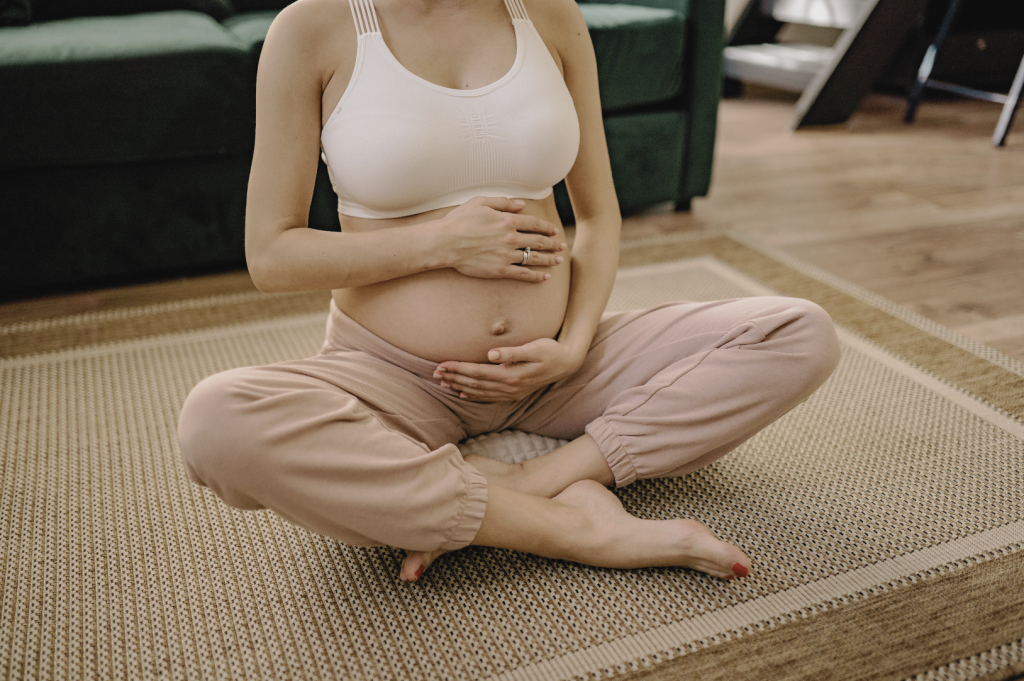 Zen Mom pregnant yogini holding belly